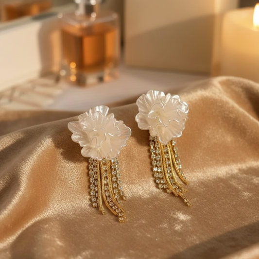 Elegant white flower earrings with sparkling diamond drops
