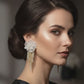 Elegant white flower earrings with sparkling diamond drops